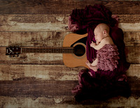 artistic-photo-of-newborn-baby-on-a-guitar-islington-london